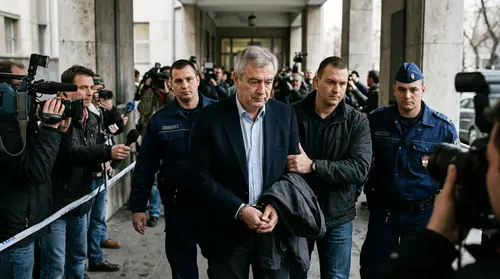 Authentic editorial documentary photograph: Former governor of Hungarian central bank in custody